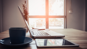 What is a website supposed to do — laptop and tablet on a desk representing small business web presence.